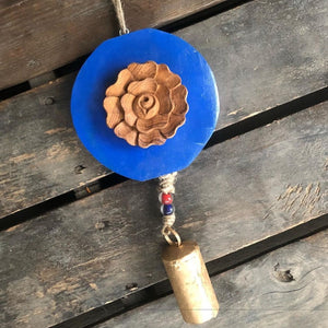 Carved  wood rose on Royal blue log