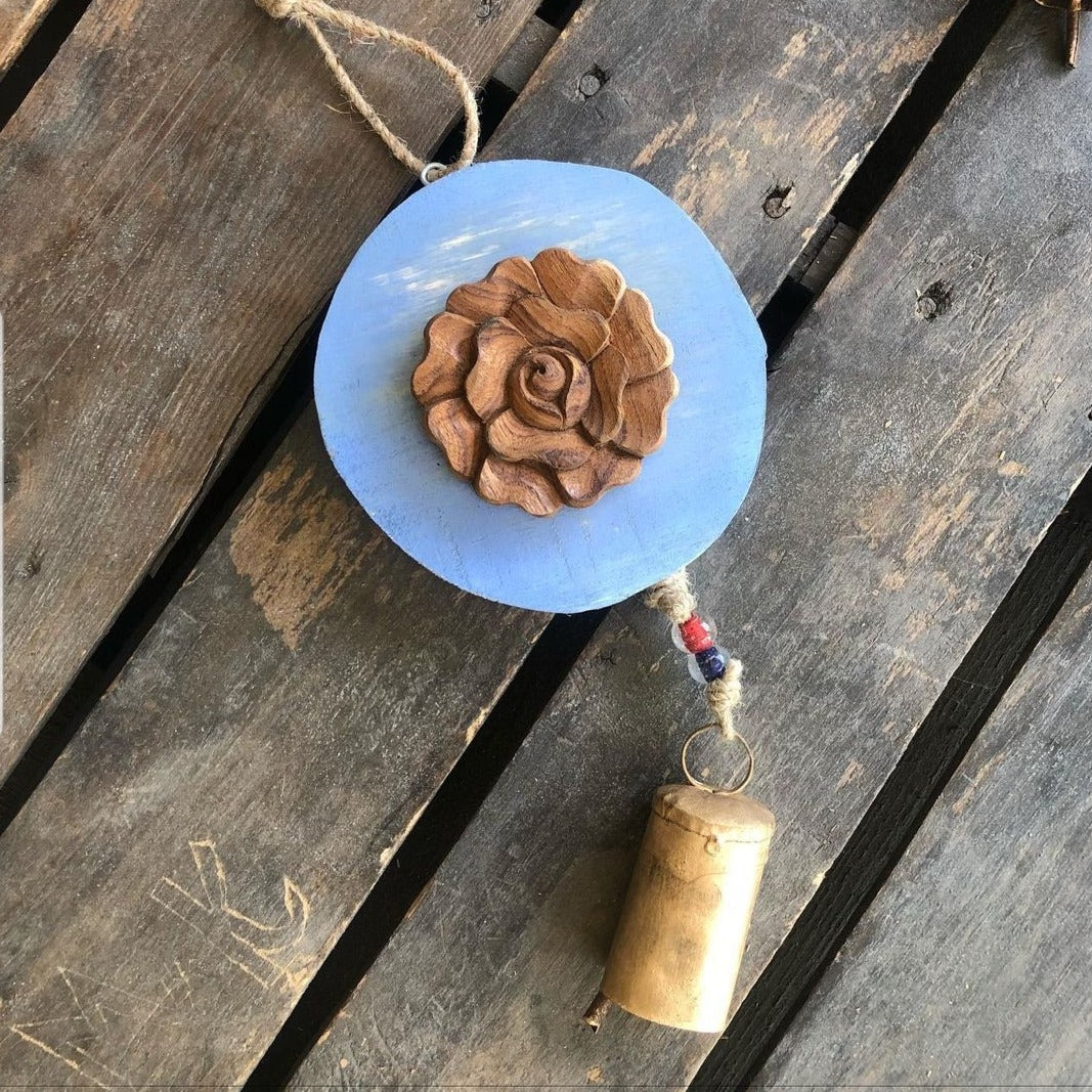 Carved  wood rose on Light Blue log