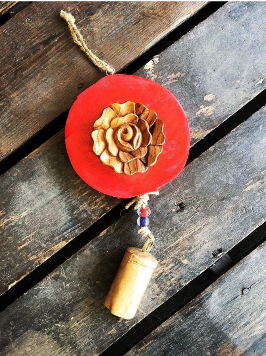 Carved  wood rose on Red log