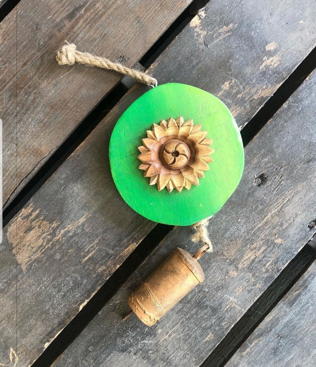 Carved  wood flower on Green log