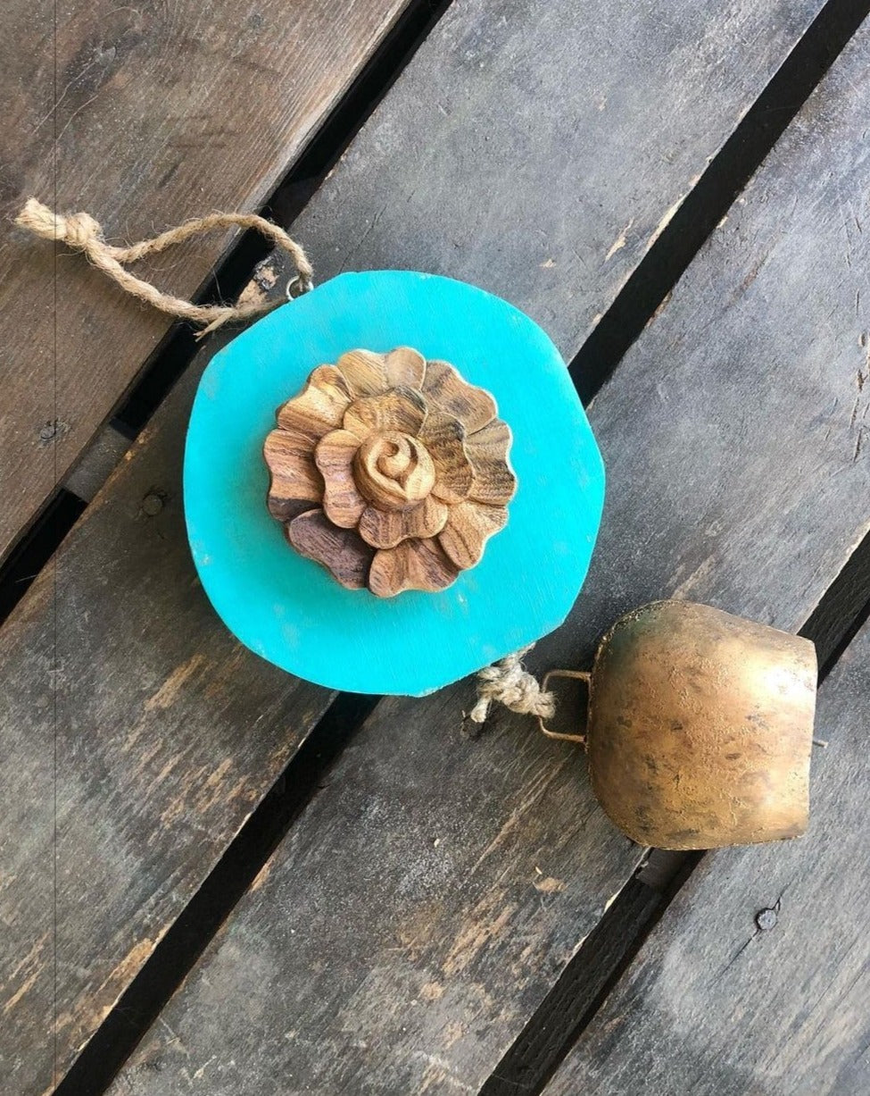 Carved  wood rose on Teal log