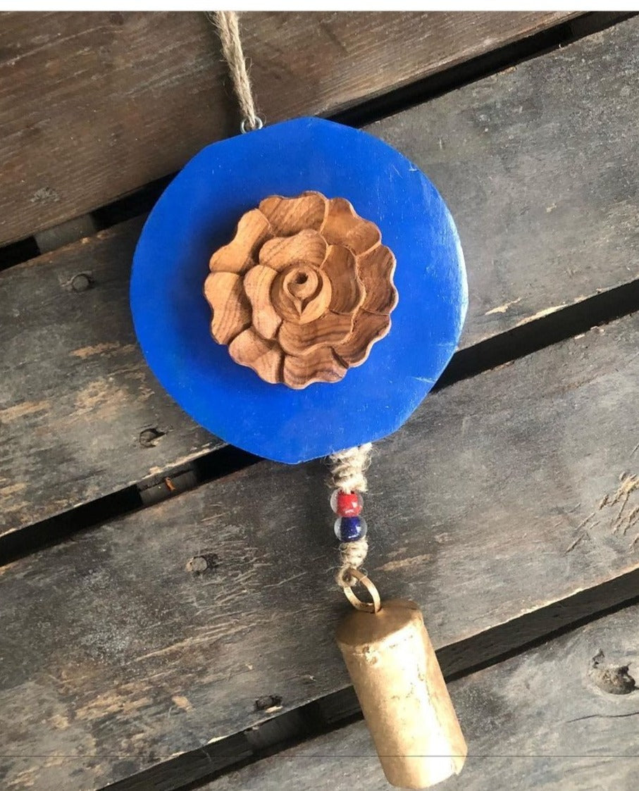Carved  wood rose on Royal blue log