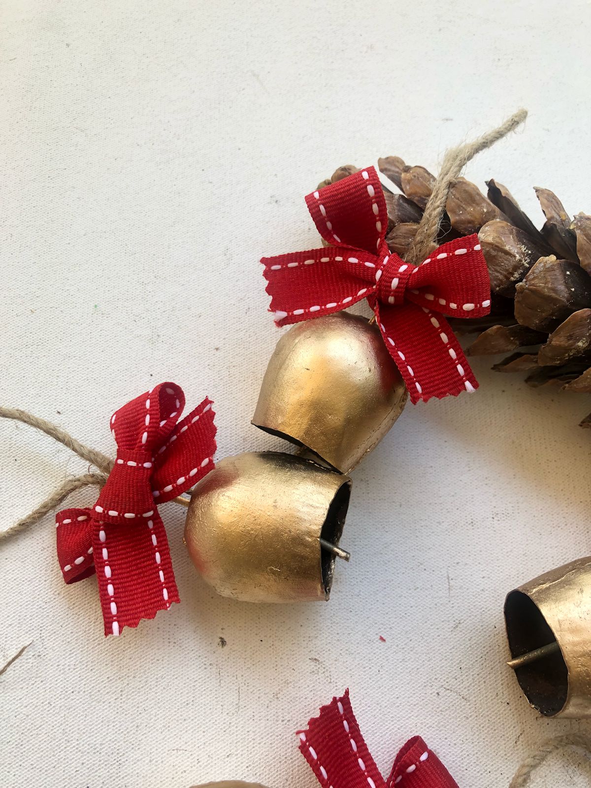 2" Metal Bells with red stitched edge bow