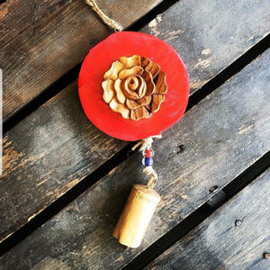 Carved  wood rose on Red log