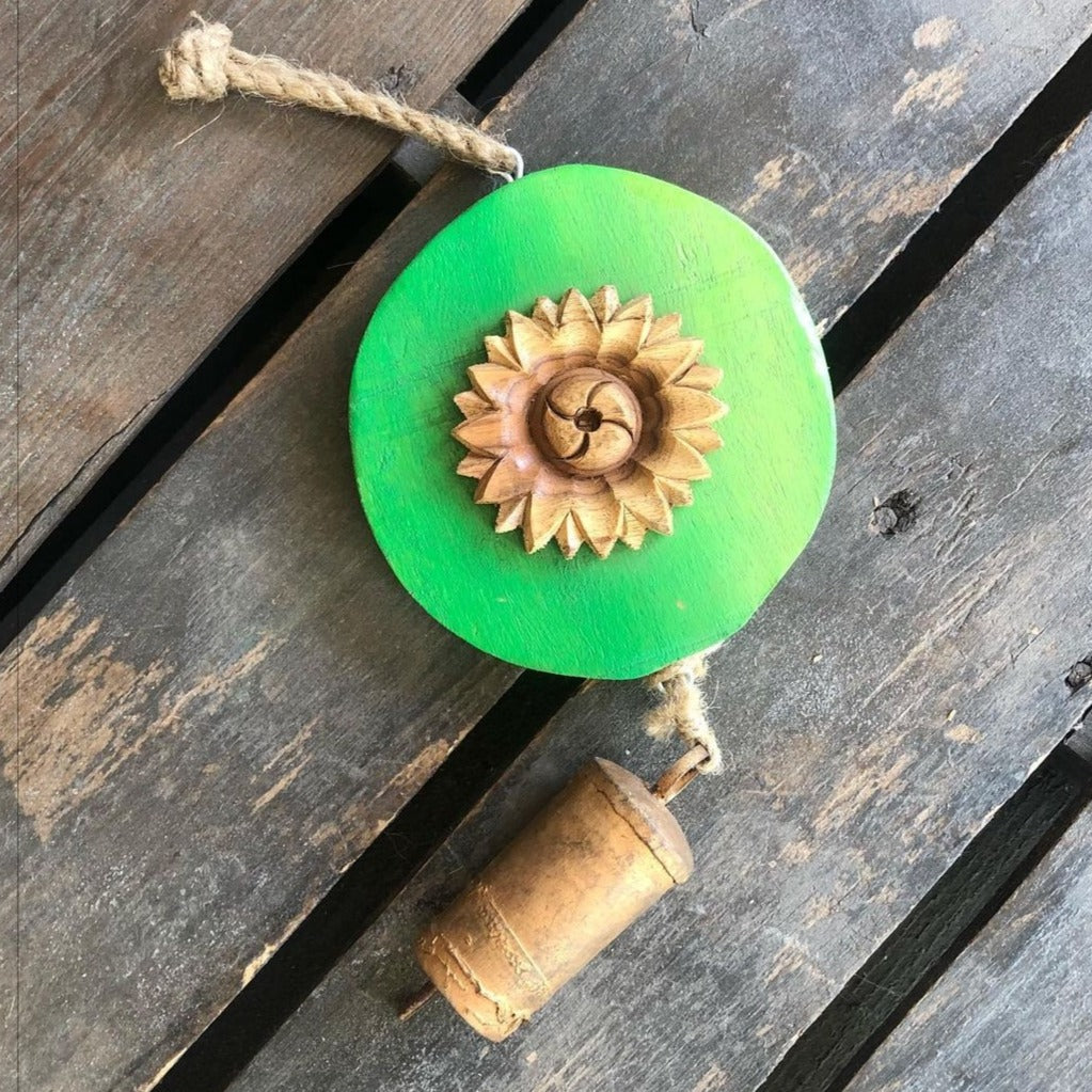 Carved  wood flower on Green log